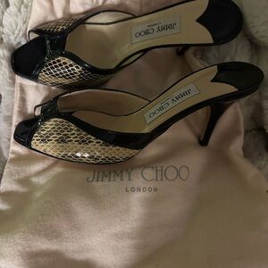 Jimmy Choo Black and Beige Snakeskin slip on mule with dust bag.